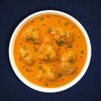 Chicken Korma Curry · Free range chicken cooked in a rich, creamy tomato, and onion curry