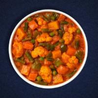 Vegetable Korma  · Blend of  vegetables cooked with exotic spices and creamy Tikka Masala sauce