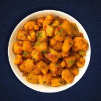Aloo Gobi (Vegan)  · Idaho potatoes and fresh cauliflower cooked with spices, tomatoes & onions.