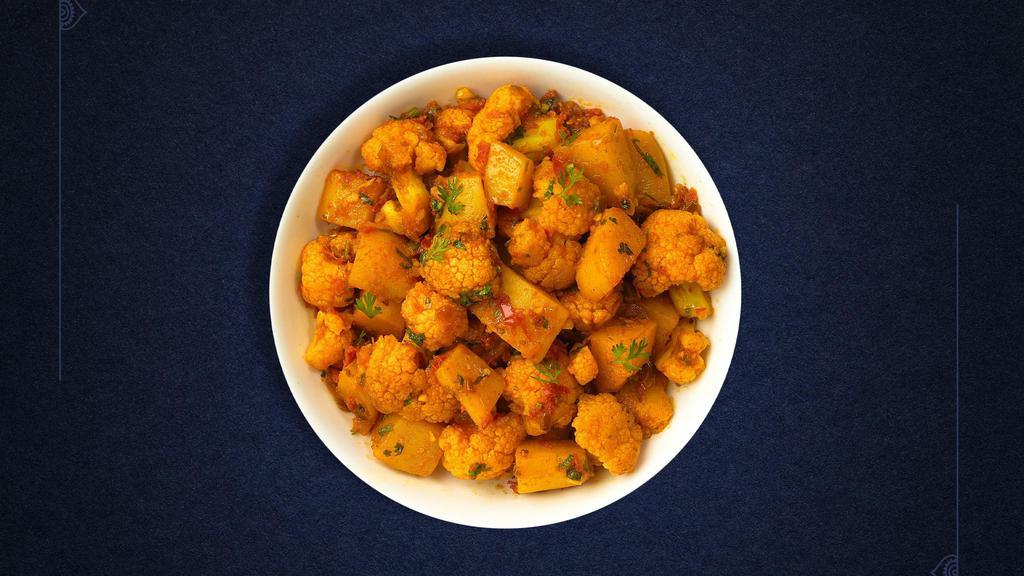 Aloo Gobi (Vegan)  · Idaho potatoes and fresh cauliflower cooked with spices, tomatoes & onions.