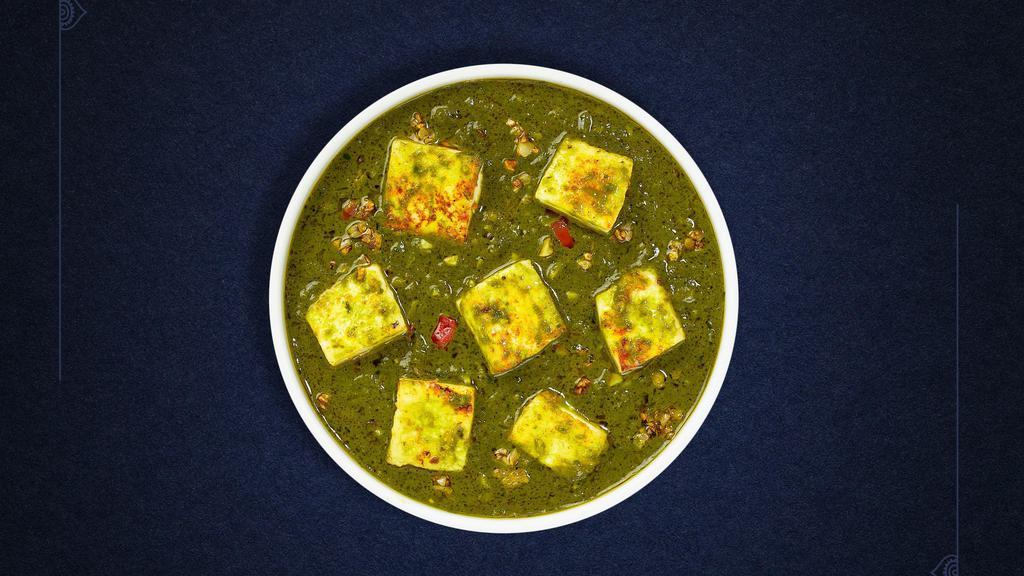 Saag Paneer · Cubes of fresh indian cheese cooked in a spinach gravy infused with garlic, ginge, and spices.