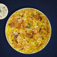 Prawns Biryani · Jumbo prawns cooked with biryani  spices and layered with basmati rice. Served with house ra...