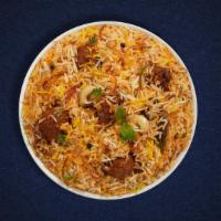 Goat Biryani W/ Bone · Tender pieces of goat meat  cooked with biryani  spices and layered with  basmati rice. Serv...