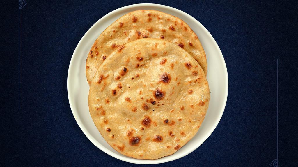 Roti (Tandoori Roti) · Whole wheat Indian bread cooked in a clay oven.