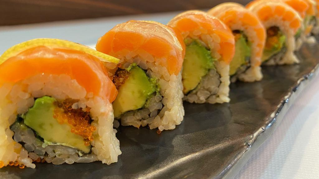 49’s Roll · salmon, tobiko, avocado, and sliced of lemon with shiso.