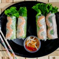 Spring Rolls · Shrimp, pork, vermicelli, and letture spring roll served with peanut sauce.