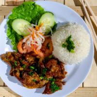 Grilled Pork Rice Pate · Grilled marinated pork slices served with steam rice and green salad.
