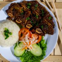 BBQ Short Ribs Rice Plate · BBQ short ribs served with steam rice and green salad.