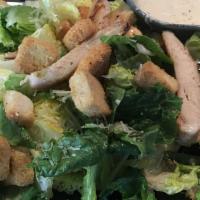 B3. Caesar Salad · Baby hearts of romaine shaved parmesan cheese croutons and caesar dressing.