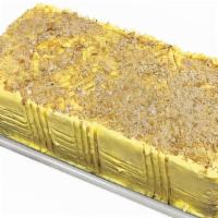 Sans Rival Small · Four-layers of meringue wafer, rich buttercream icing and scrumptious cashew nuts.