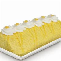 Mango Roll · Rich butter icing mixed with juicy mango bits tucked in a roll of moist chiffon cake.