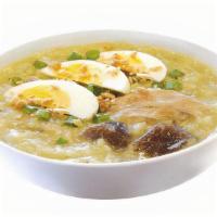 Arroz Caldo - Individual · Flavorful chicken and rice congee with shiitake mushrooms, egg slices, green onions and frie...