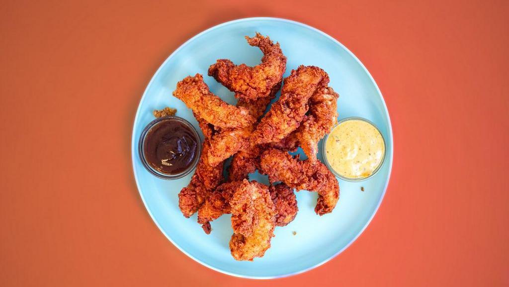 10 Nashville Hot Tenders · Crispy chicken tenders that get twisted + tossed with our Nashville Hot sauce and topped with tangy pickles. Includes your choice of 3 sauces. Served with waffle fries.