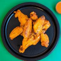 Bone In  · Bone In Chicken Wings tossed with your choice of flavor.