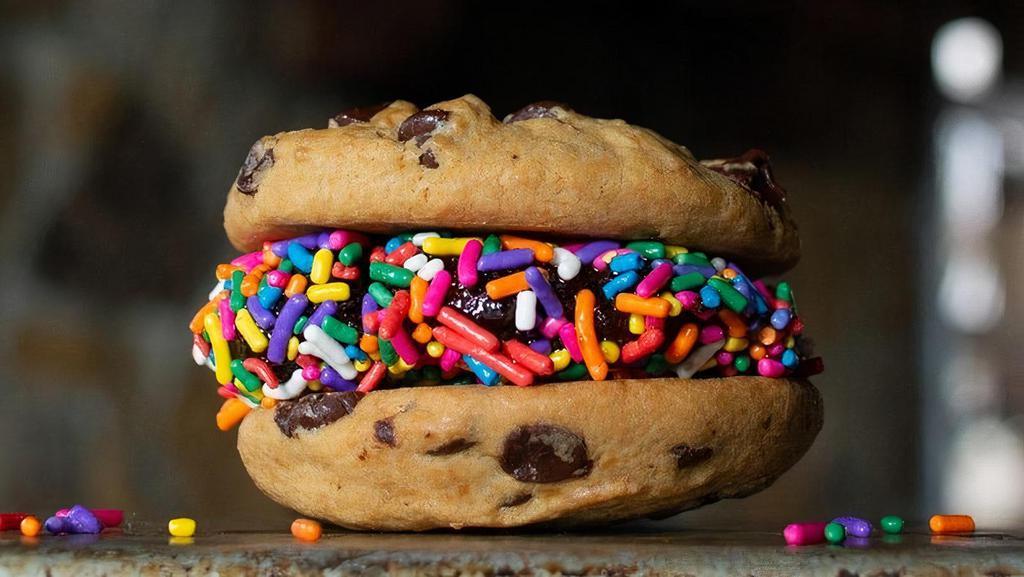 Cookie Smash · Fudge Brownie smashed between two fresh baked chocolate chip cookies and coated with sprinkles.