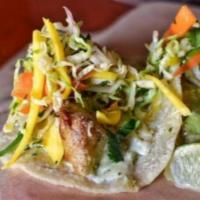 Fish Tacos · Cod, habañero tartare sauce, mango slaw, fresh tortillas.