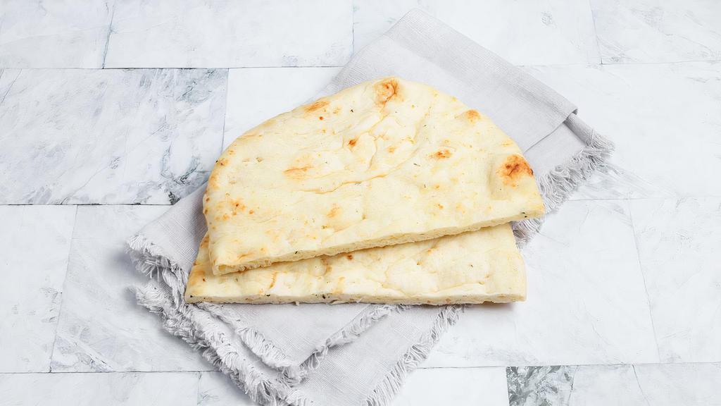 Garlic Naan by dosa by DOSA · By dosa by DOSA. Indian style flatbread with roasted garlic, a favorite side to every Indian curry, dal, and rice.  Contains gluten, dairy, soy, and eggs. We cannot make substitutions.