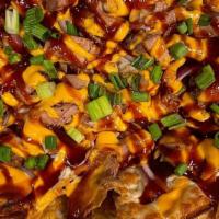 BBQ Nachos · Lola's Crispy Tortilla Chips Toasted with your choice of Smoked Chicken, Tri Tip, Pork Tende...