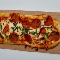 Pepperoni and Basil Flatbread Pizza · Zesty Marinara Sauce, Mozzarella Cheese, Pepperoni, Finished with Fresh Basil and Red Pepper...