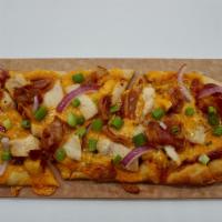 BBQ Chicken Flatbread Pizza · BBQ Sauce, Cheddar Cheese, Chicken Breast, Bacon, Sliced Red Onion, Finished with Green Onions