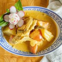 L7. Yellow Curry Chicken · Chicken simmered in coconut milk with yellow curry, potatoes, tomatoes, and onion.