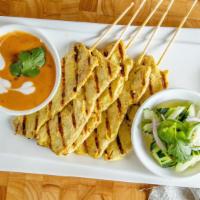 5. Satay · Chicken skewers marinated with Thai spices in coconut milk, served with peanut sauce and cuc...
