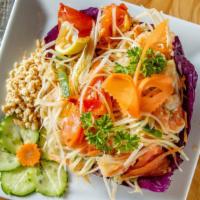 12. Som Tum · Fresh green papaya, carrot, green bean, shrimp, tomato, and chili tossed with lime juice and...