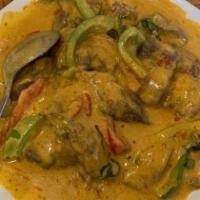 47. Panang Beef · Tender beef simmered in coconut milk, panang curry, kaffir leaves, bell peppers, and Thai ba...