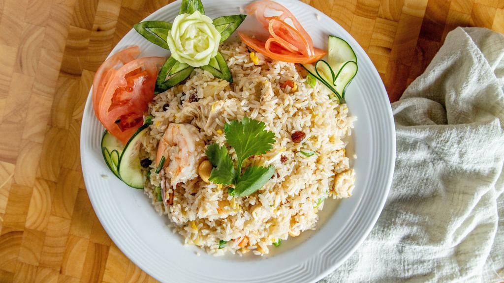86. Pineapple Fried Rice · Fried rice with chicken, prawn, pineapple, raisins, egg, onion, and cashew nuts.