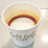 Macchiato · A double shot of espresso with a dash of foam on top.