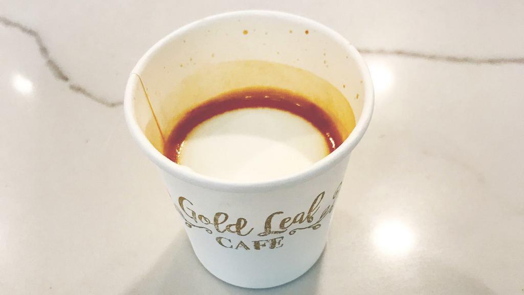 Macchiato · A double shot of espresso with a dash of foam on top.