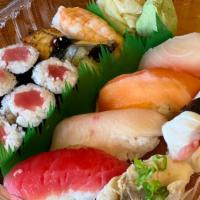 Sushi Combo Deluxe · 14 pieces. Tekka Maki, Maguro, Hamachi, Ebi, Unagi, Sake, Tako, Tai & Saba