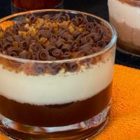 Coppa Mascarpone · Chocolate cream layer followed by a smooth mascarpone cream topped with amaretto cookie crum...