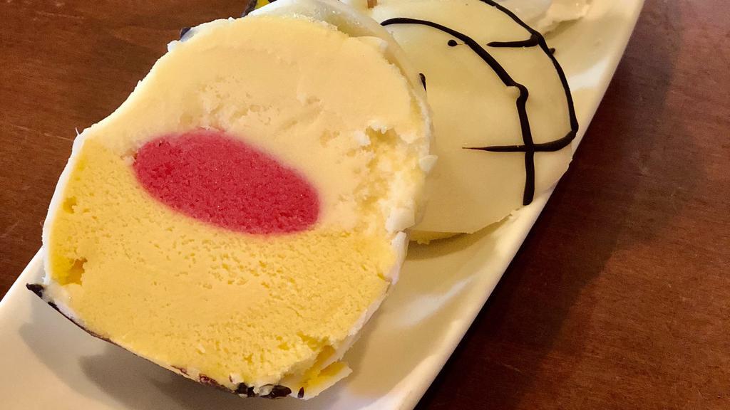Mango & Passion Fruit Bomba · Mango, passion fruit and raspberry sorbetto all covered in white chocolate and drizzled with chocolate.