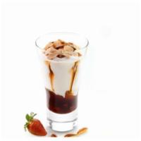 Coppa Strawberries & Caramel · Fior di Latte gelato swirled with caramel, almond crunch & wild strawberries, topped with sl...
