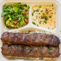 1. Beef Kebabs Plate · Two skewers of ground beef kebab,Hummus, salad and rice