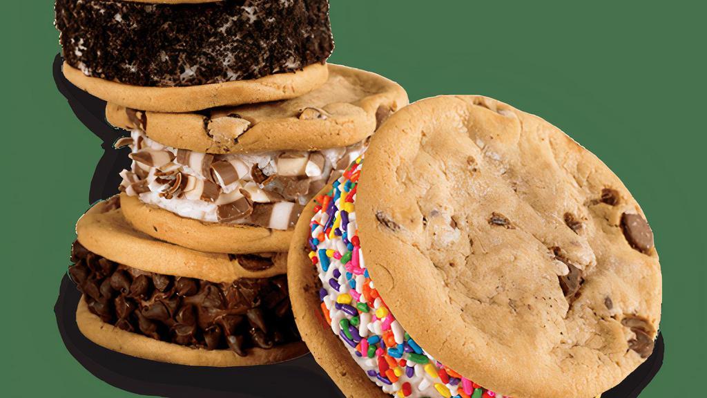 Ice Cream Cookie Sandwich Variety 4-Pack - Ready For Pick-Up Now · One of each of our Cake Batter™ Sprinkle, Cookie Crumb Yum, Kiss N' Tell Chocolate, and Perfect Duet Ice Cream Cookie Sandwiches. Cake Batter™ Sprinkle: Cake Batter Ice Cream® sandwiched by moist Chocolate Chip Cookies and rolled in Rainbow Sprinkles.     . Cookie Crumb Yum: Sweet Cream Ice Cream sandwiched by moist Chocolate Chip Cookies and rolled in OREO® Cookie.     . Kiss N' Tell Chocolate: Chocolate Ice Cream sandwiched by moist Chocolate Chip Cookies and rolled in Chocolate Chips.     . Perfect Duet: Sweet Cream Ice Cream sandwiched by moist Chocolate Chip Cookies and rolled in White & Milk Chocolate.