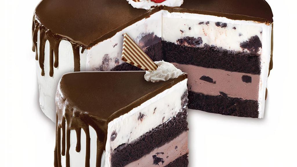 Tall, Dark & Delicious - Ready For Pick Up Now · Layers of moist Devil’s Food Cake, Sweet Cream Ice Cream with Brownies and Chocolate Ice Cream with OREO® Cookies wrapped in fluffy White Frosting and cascading Fudge Ganache
