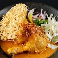 Kao Soi Gai · Braised chicken quarter leg in Thai’s Northern style curry and egg noodle top with cabbage, ...