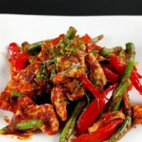 Prik Khing Gai · House-made ginger-chili paste, stir-fried with green bean and sliced chicken breast. Served ...