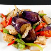 Pad MA Kuer Yao · Tofu, eggplant, bell pepper, and basil stir fried in garlic and soybean paste sauce. Served ...