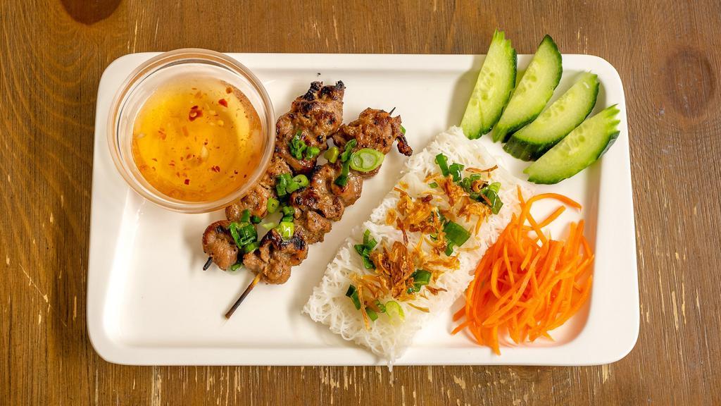 Grilled Pork Skewer · Served with rice vermicelli woven square, roasted peanuts and scallions.