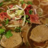 Pho · Noodle soup, serve with bean sprout and basil on side.