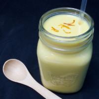 Mango Lassi · Mango flavored yogurt drink with a hint of saffron