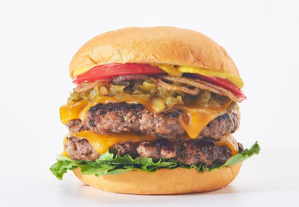 Chicago Burger · 4 Oz. Fresh, Never Frozen Patties, On a Brioche Bun with Caramelized Onions, Cheddar Cheese, Lettuce, Tomato, Pickle Relish, and  YELLOW MUSTARD by HEINZ®