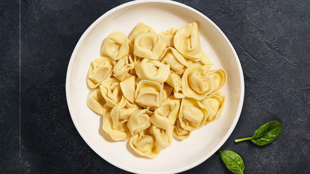 Veal, Ham and Mortadella Tortellini  · Veal, ham and mortadella tortellini cooked with sauces and toppings of your choice.