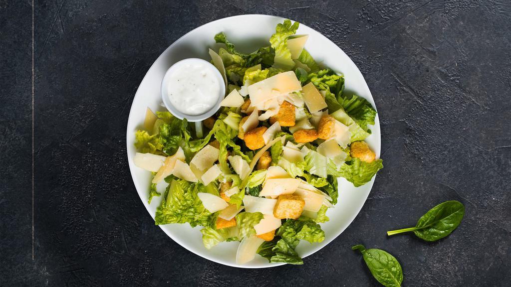 Caesar Salad · Romaine lettuce, shaved Parmigiano Reggiano and croutons served with our housemade classic Caesar dressing.