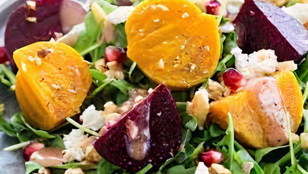Roasted Beet Salad · Red beets, organic greens, arugula, red onions, candied walnuts and goat cheese served with our housemade honey-lemon vinaigrette dressing.
