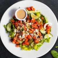 Greek Salad · Romaine lettuce, organic greens, Kalamata olives, Roma tomatoes, red onions, cucumbers, bell...