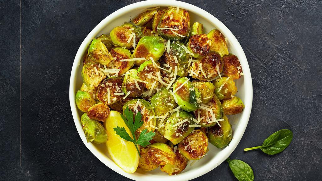 Roasted Brussel Sprouts · Roasted brussel sprouts cooked with bacon, Red cabbage, Garlic, Lemon, Parmigiano and Chili flakes
